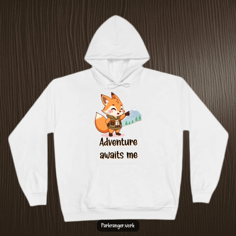 Funny Fox Ranger Hoodie: A cute fox sprite dons a ranger vest, pointing eagerly towards a mountain, symbolizing adventure.