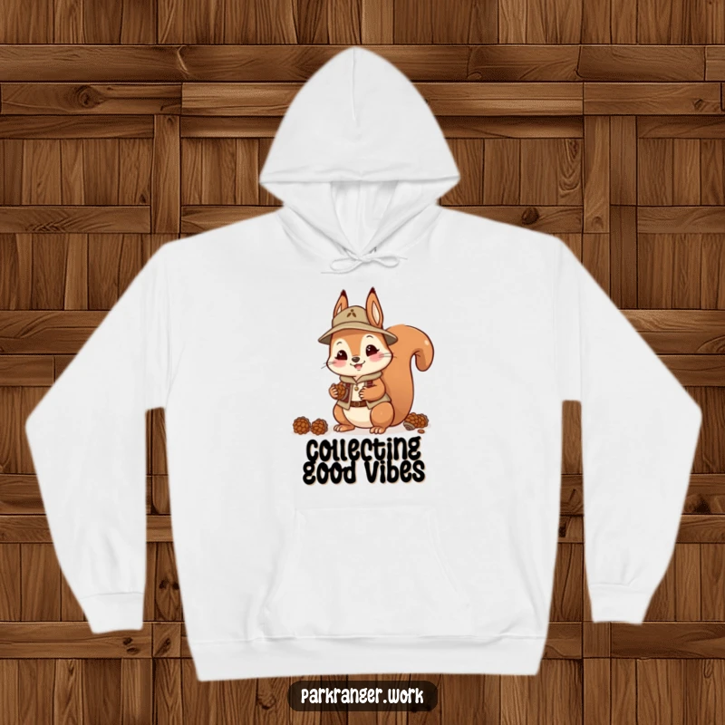 Funny Squirrel Ranger Hoodie: A playful squirrel in a ranger outfit happily gathers pinecones, embodying industrious joy.